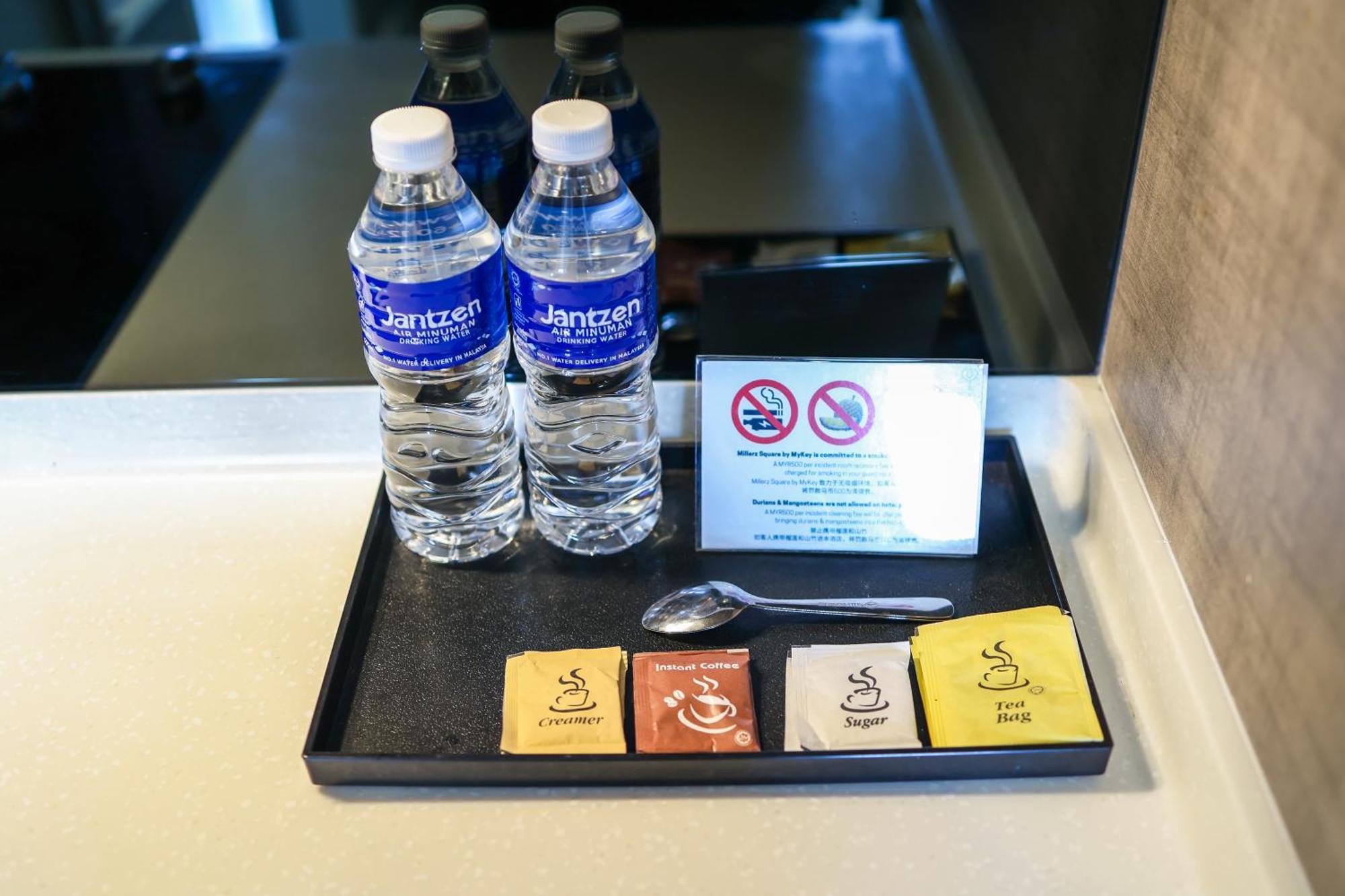 Апартаменты Millerz Square By Mykey Куала-Лумпур Экстерьер фото Bottled water and tea bags in a hotel room